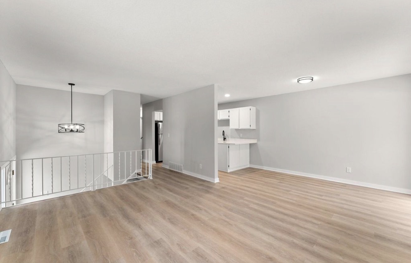 Open finished living room with LVP flooring