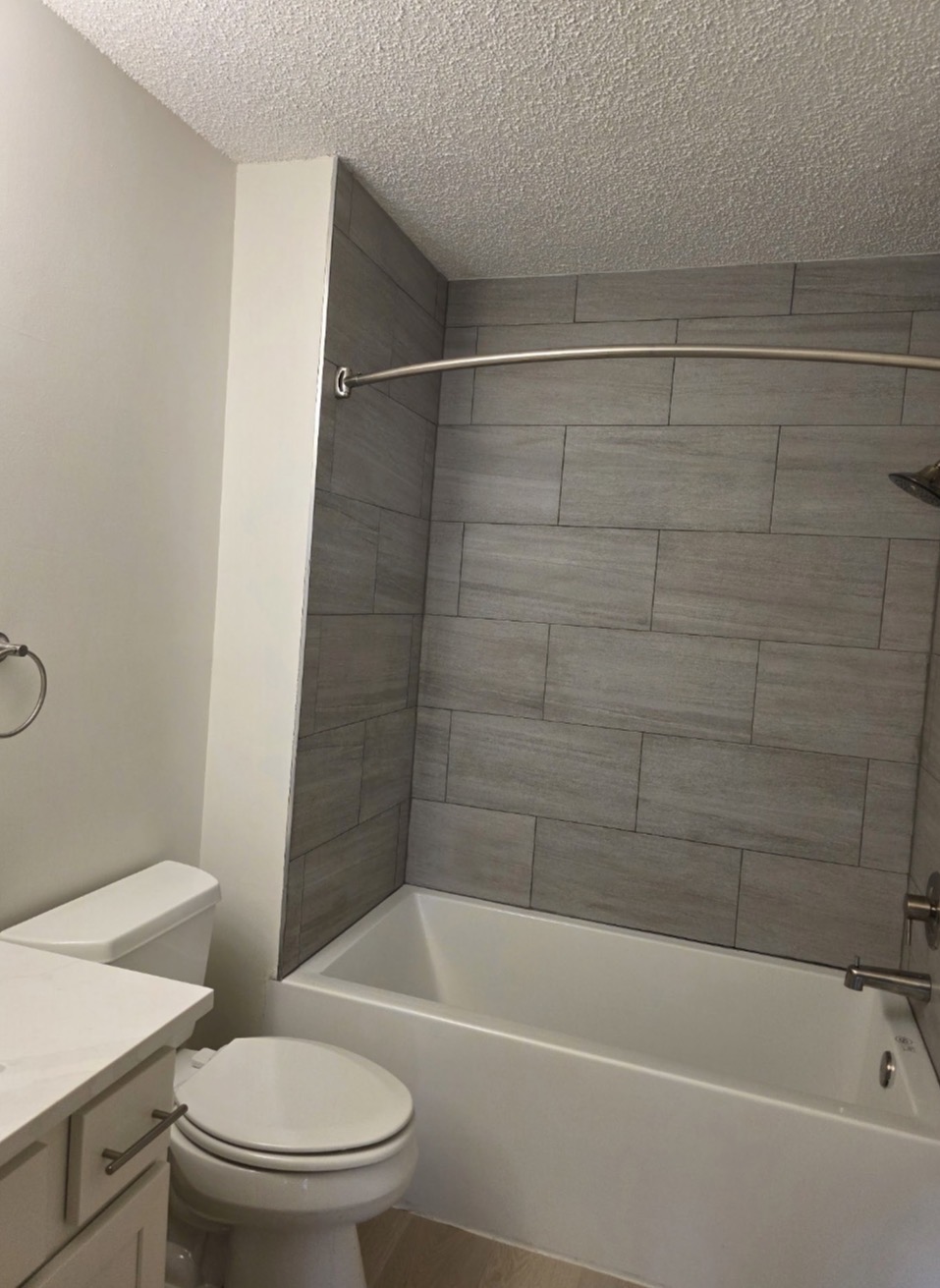 Tiled Shower and Toilet