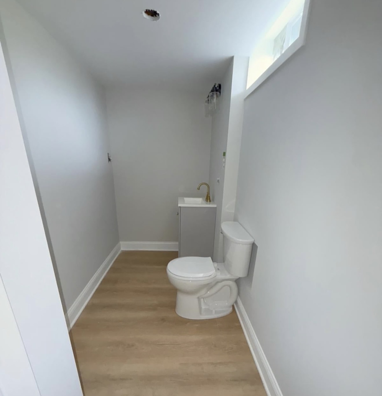 Narrow Bathroom with Toilet and Sink